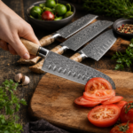 5-piece handmade kitchen knife set with Damascus-style patterned blades, burl wood handles, and polished bolsters on natural stone background