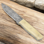 Handmade Damascus hunting knife with twist-pattern Damascus steel blade, camel bone handle, and genuine leather sheath.