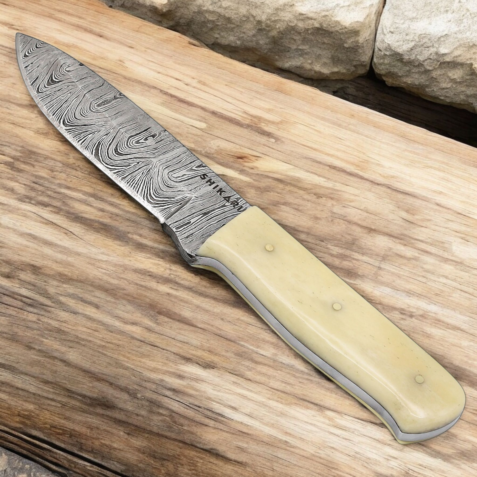 Handmade Damascus Hunting Knife with Camel Bone Handle (1) Handmade Damascus hunting knife with twist-pattern Damascus steel blade, camel bone handle, and genuine leather sheath.