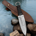 Handmade throwing knife with black wrapped handle and leather sheath