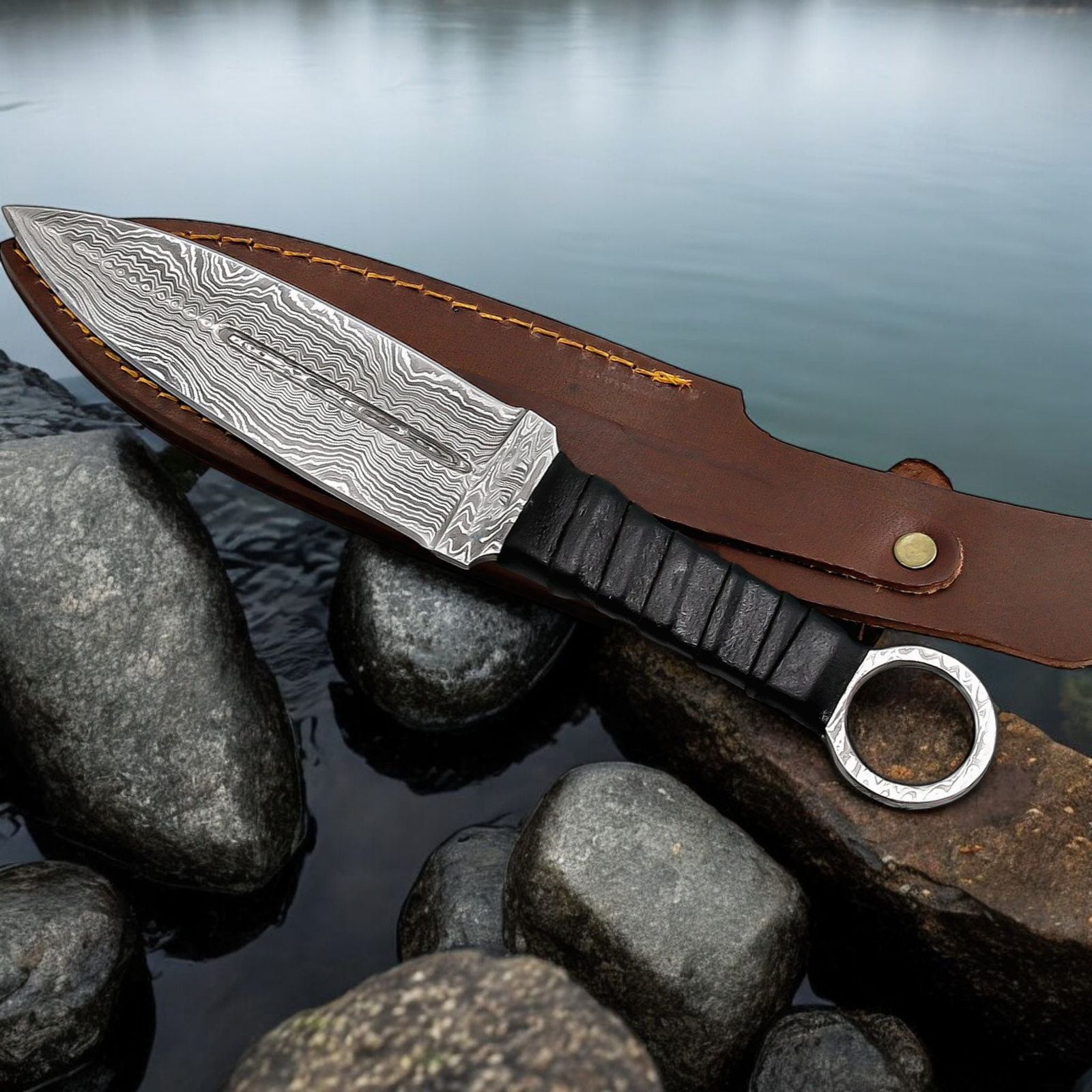 Handmade throwing knife with black wrapped handle and leather sheath