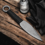 Handmade throwing knife with black wrapped handle and leather sheath