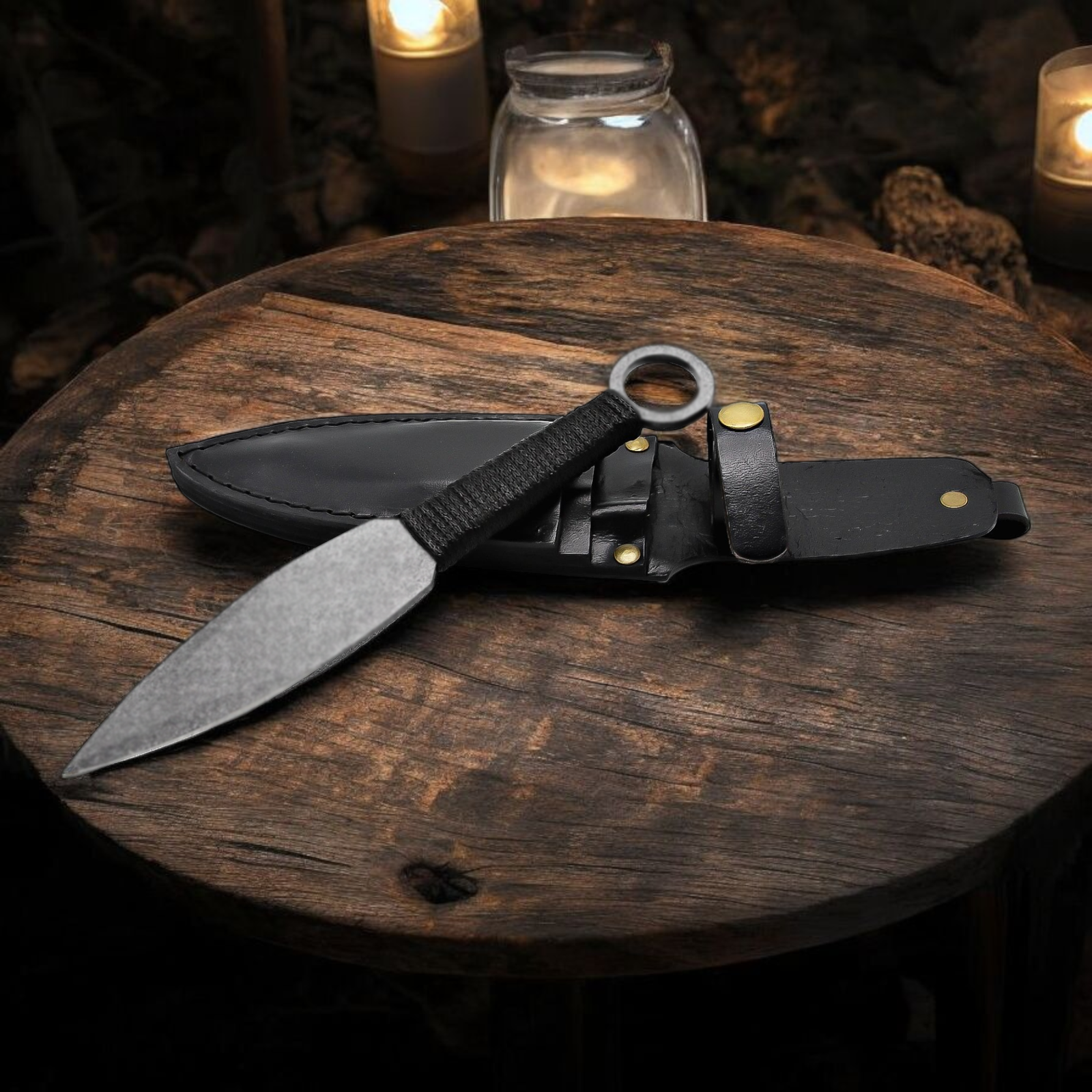 Handmade throwing knife with black wrapped handle and leather sheath
