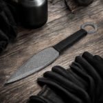 Handmade throwing knife with black wrapped handle and leather sheath
